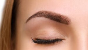 Close-up of powder brows semi permanent makeup treatment in London showing soft shading and natural gradient effect